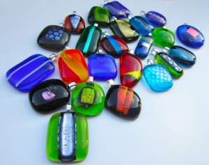 bunch of pendants of various colours and shapes