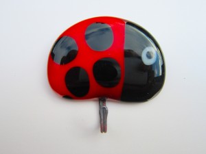 Glass tea towel holders with colourful ladybird design