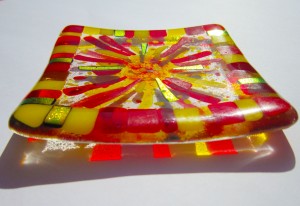 small decorative dish with sun design