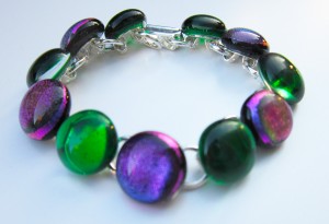 bracelet with alternate dichroic and glass cabochons